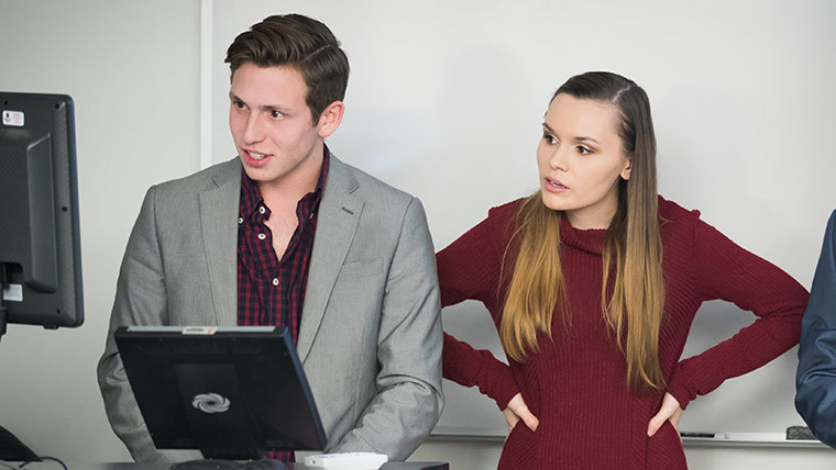 Two students presenting to a class.